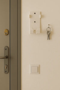 Med-Pat BR-31 wall mount holder installed on a wall near a door, with keys hanging beside it.